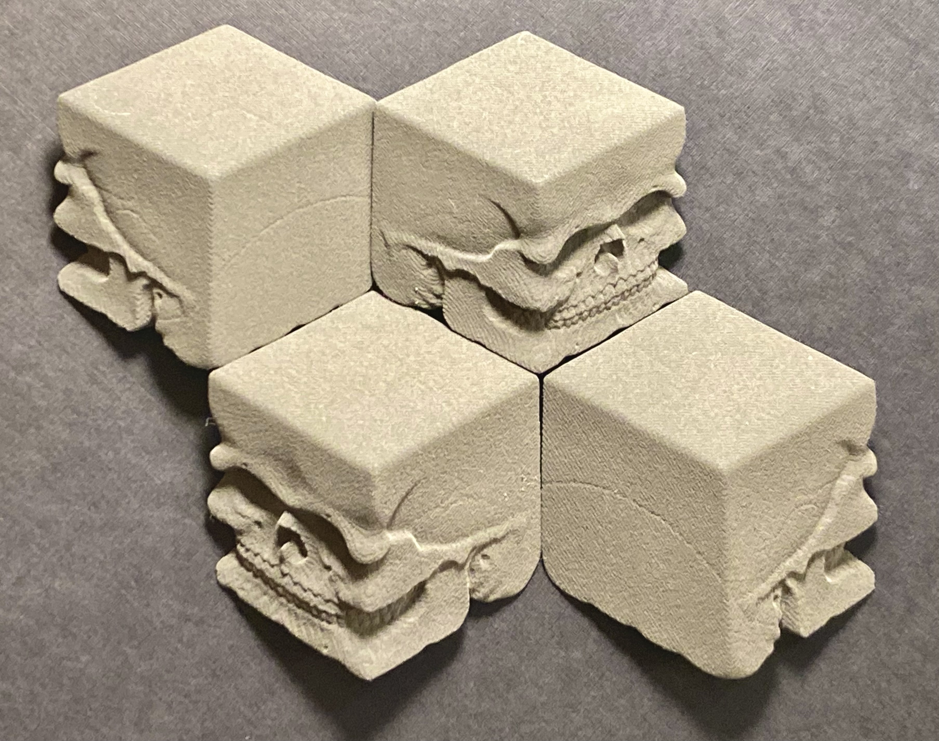 3D digital nylon printed prototype models, perspective view of Cube Skull,  2 x 2 x .75. Photo courtesy of Richard Notkin.