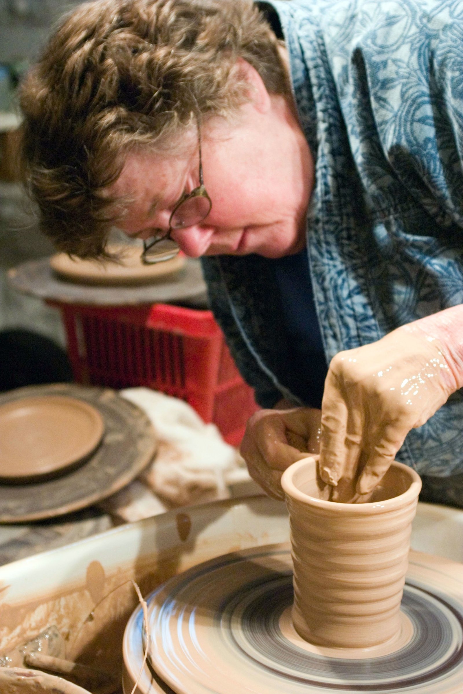 Kit at her wheel in her studio, 2005. Kit at her wheel in her studio, 2005.