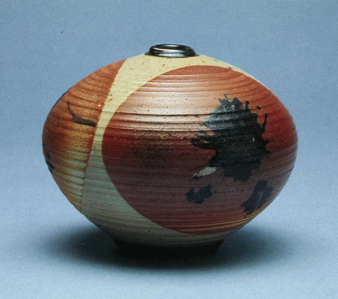 Woodfired Bottle. Porcelain, Double Dipped in Avery Clay With Black Slip Splash. 6 in. x 7 in. 1993. Woodfired Bottle. Porcelain, Double Dipped in Avery Clay With Black Slip Splash. 6 in. x 7 in. 1993.