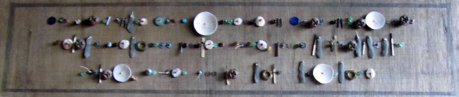 Elspeth Owen. Quantitative Easing, 2011. Pinched clay, found materials, approx. 6 x 20 x .5 in. Photo by author. Elspeth Owen. Quantitative Easing, 2011. Pinched clay, found materials, approx. 6 x 20 x .5 in. Photo by author.