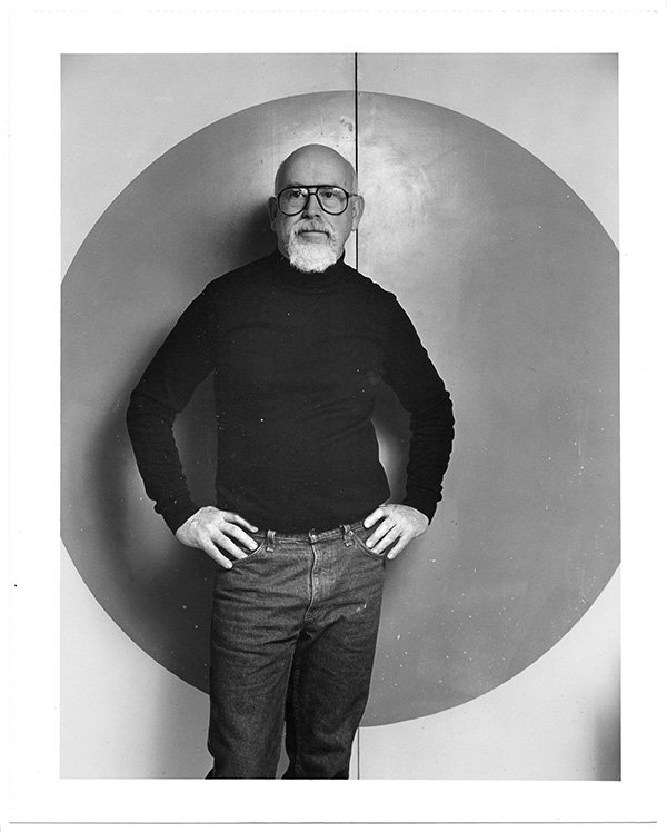 John Stephenson in front of his studio kiln room door, 1988. Photograph by Dirk Bakker. John Stephenson in front of his studio kiln room door, 1988. Photograph by Dirk Bakker.