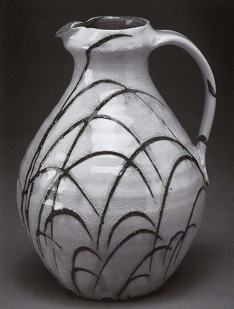 Pitcher. White slip with creek slip trailed over ash/feldspar glaze. 10.5in.