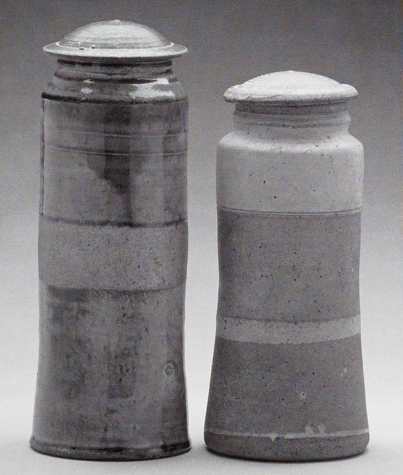 Heirloom Jars (Left) November 2003. Cone 11 woodfired stoneware, ash glaze over porcelain slip. H 12" x W 5". (Right) March 1972, bisqued, Cone 10 gas reduction stoneware, spodumene glaze. H 10.25" x W 5". Photograph by VanZandenbergen.