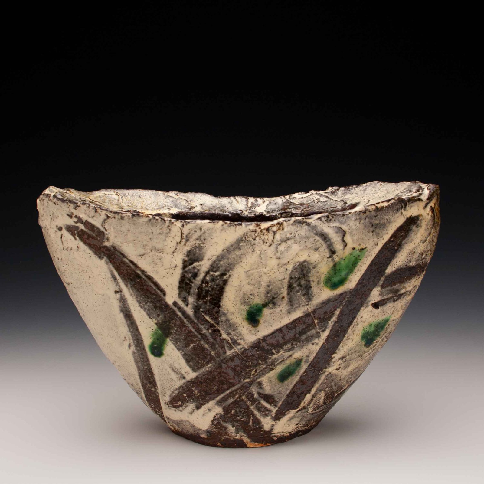 Naomi Dalglish. Shield Vase, 2016. Wild Clay, Bandana kaolin, Punchong glaze and copper; wood-fired. 10.5 x 3.5 x 7 in.