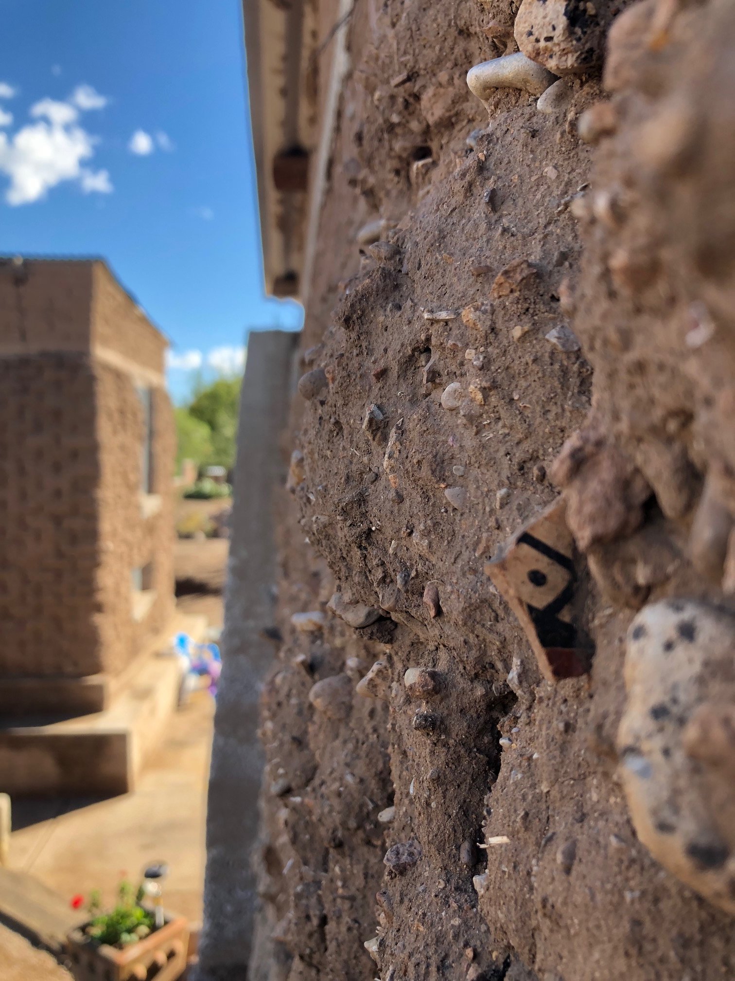 Sherds of history, the legacy of Mata Ortiz is embedded in the adobe dwellings built in the early 1900s. Here we see a sherd of Ramos Polychrome. Photo credit: Diego Valles