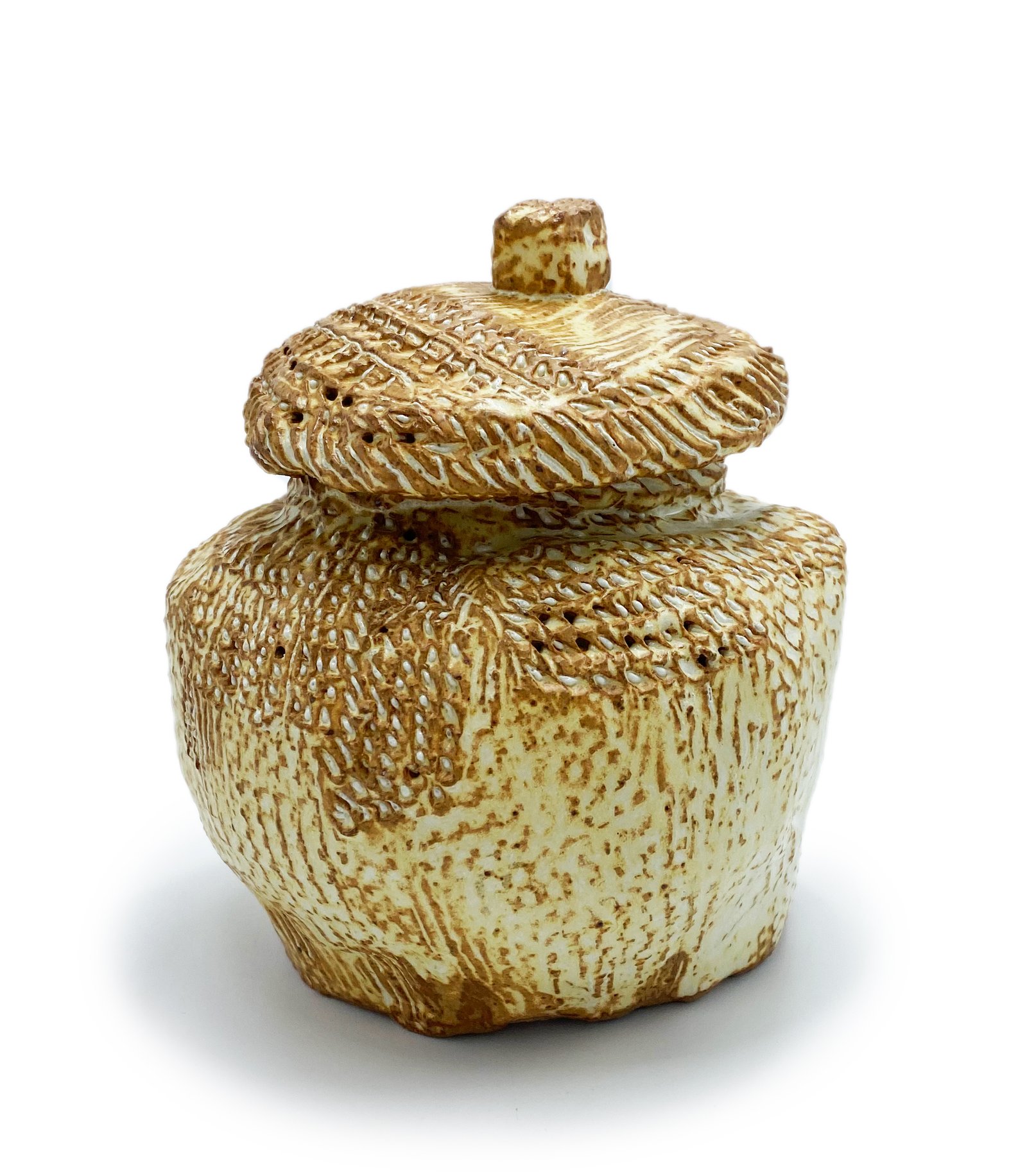 Yellow Soda Basket, Stoneware, Cone 10, approximately 6 inches tall. Photo courtesy of Northern Clay Center.