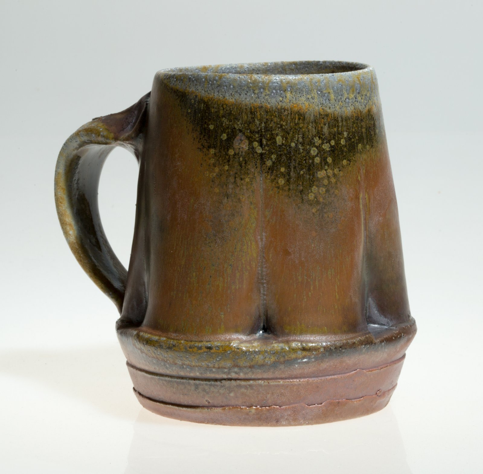 Mug, 5x4 inches, tenmoku and natural ash glaze. Wheel-thrown Stoneware. Photo credit: Jeff Becker Photography