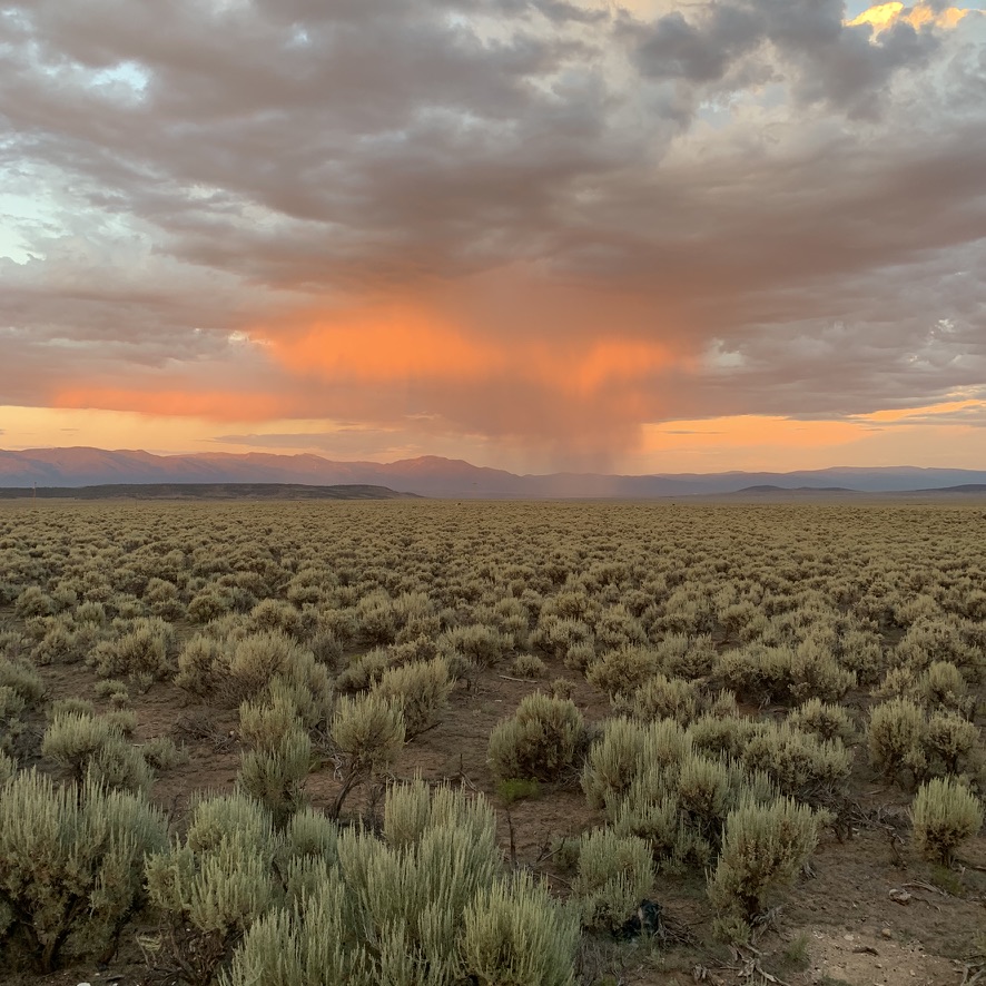 Taos mesa at sunset as a storm rolls in.