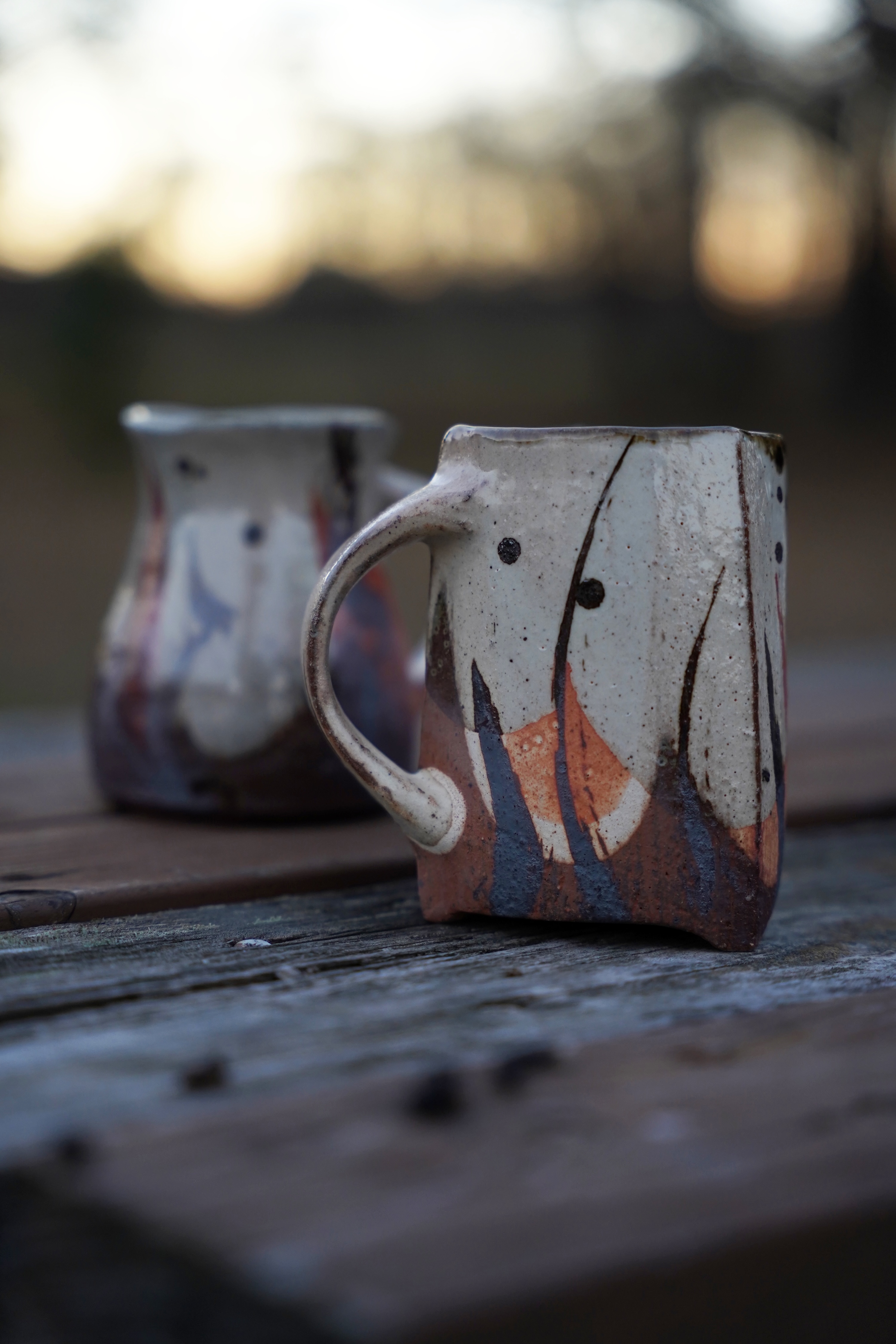 Takuro’s wood fired mug (front) and Hitomi’s wood fired mug (back).
