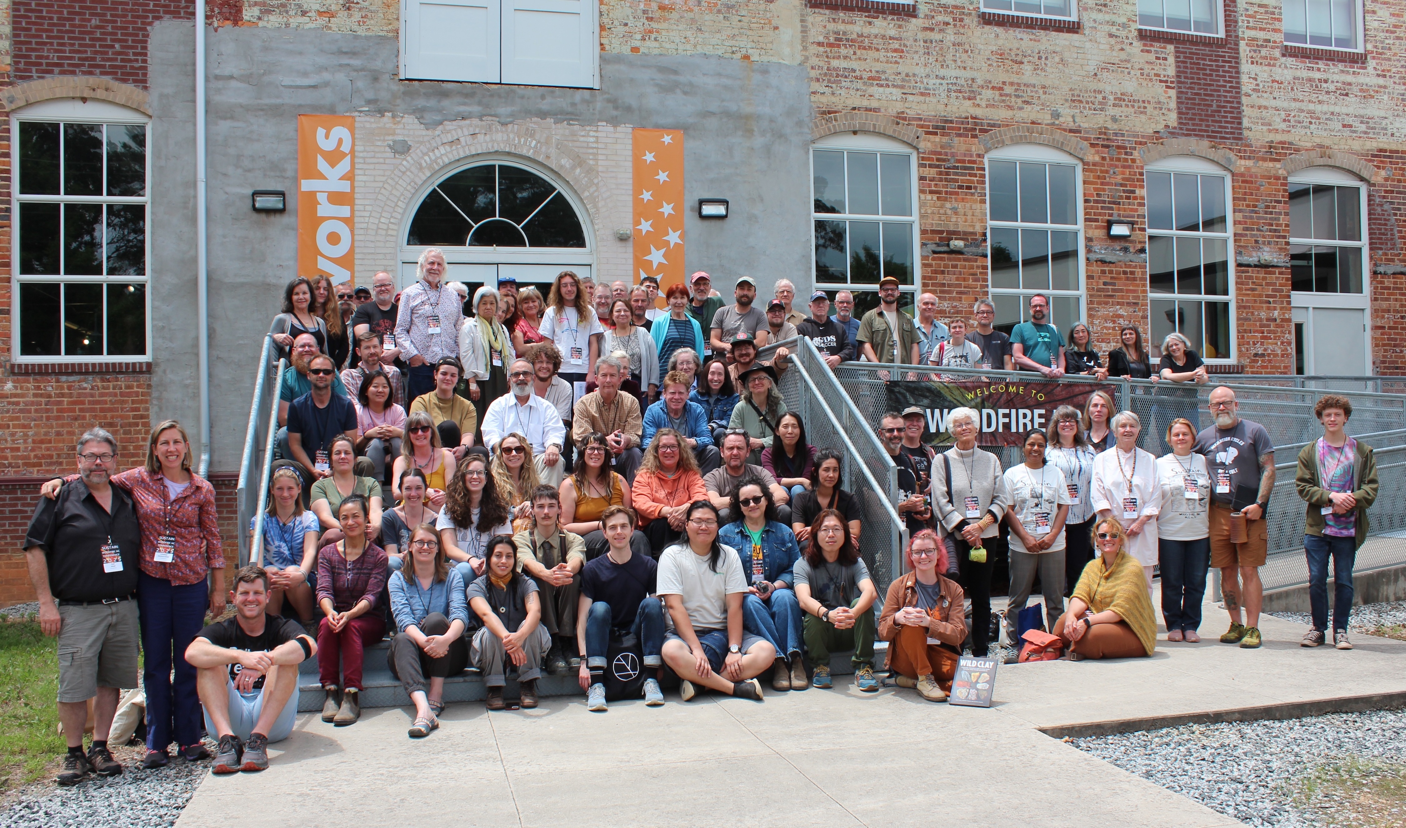 Conference participants gathered for a group photo at the Woodfire NC conference, hosted by Starworks NC in May 2025. Photo Credit © WoodfireNC