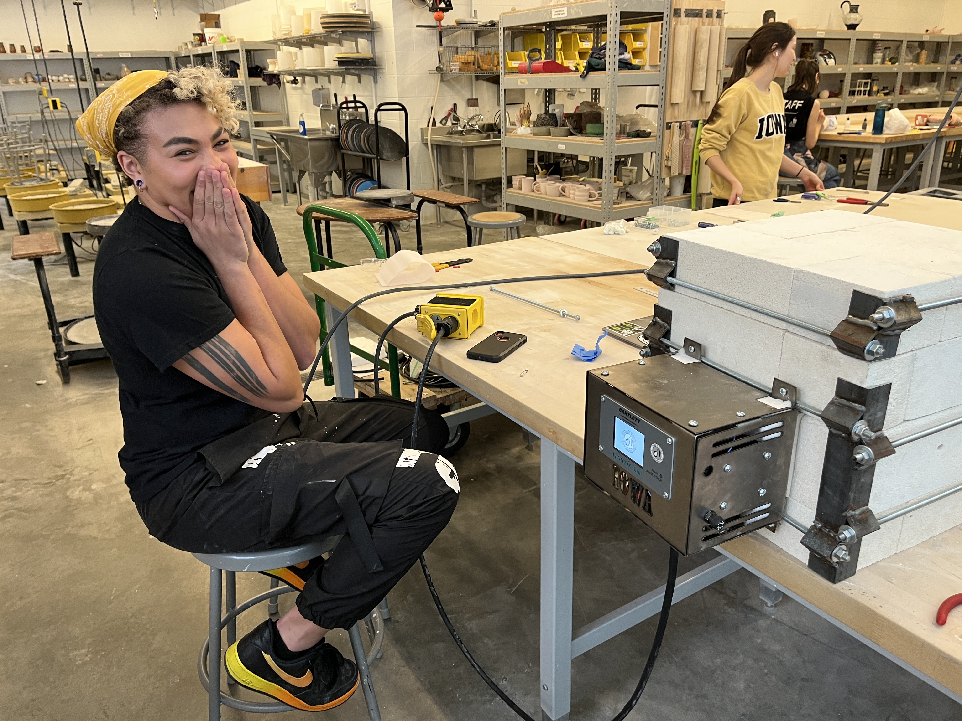 BFA student, Indya Smith Johnson, with kiln, 2023.