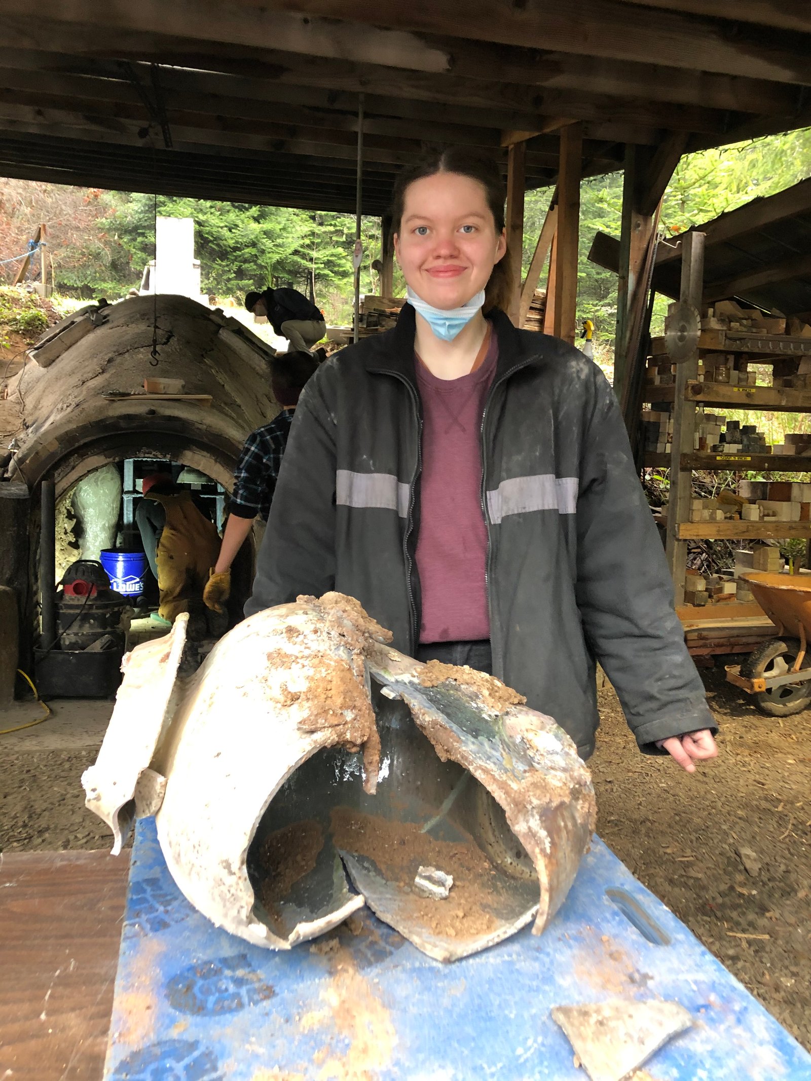 Lily and her firebox pot from her first anagama firing at East Creek, January 2021