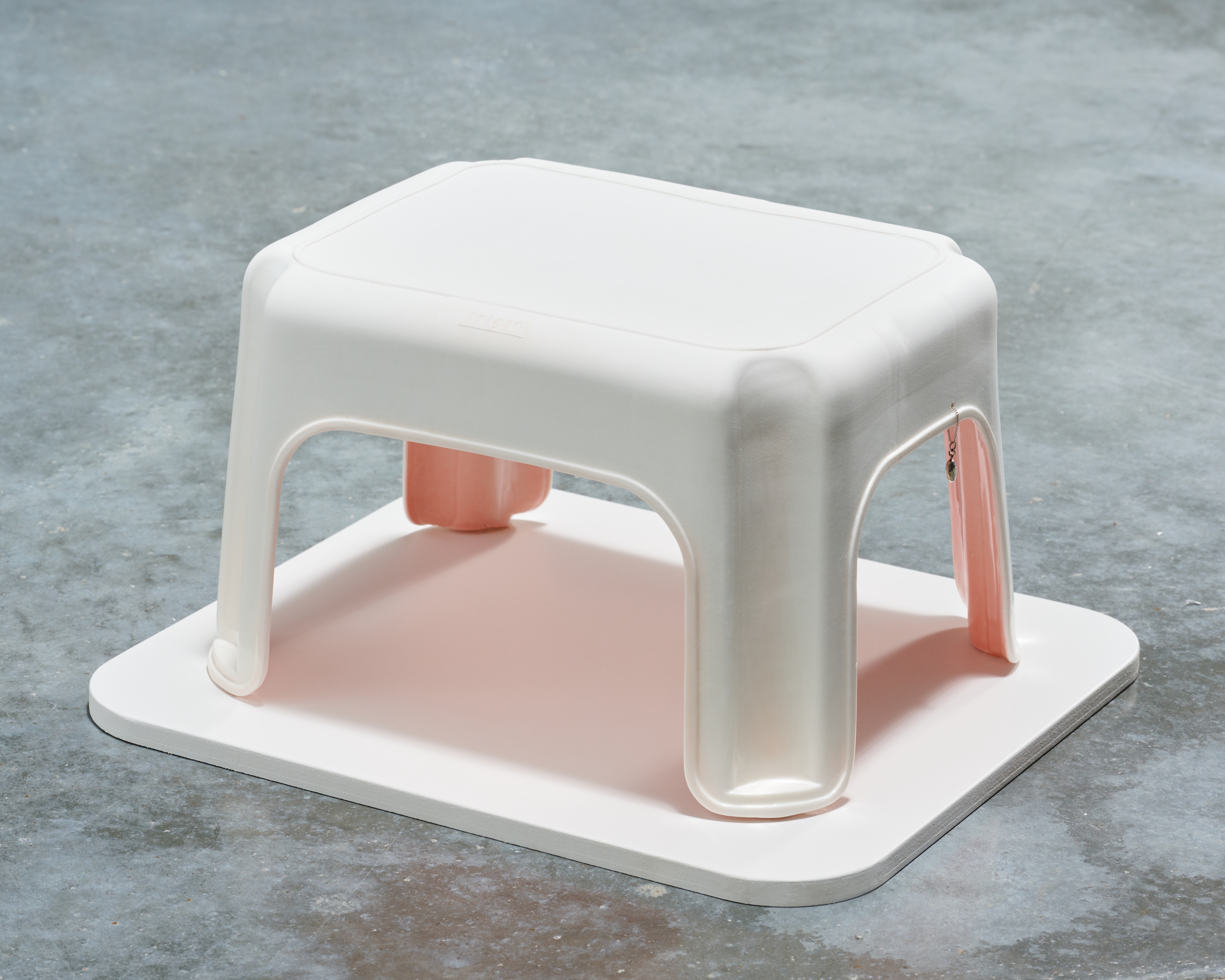 Jocelyn Reid, “Self-Portrait as a Step Stool”, 2023, Porcelain, glaze, silver necklace. 8” x 13” x 10.5”