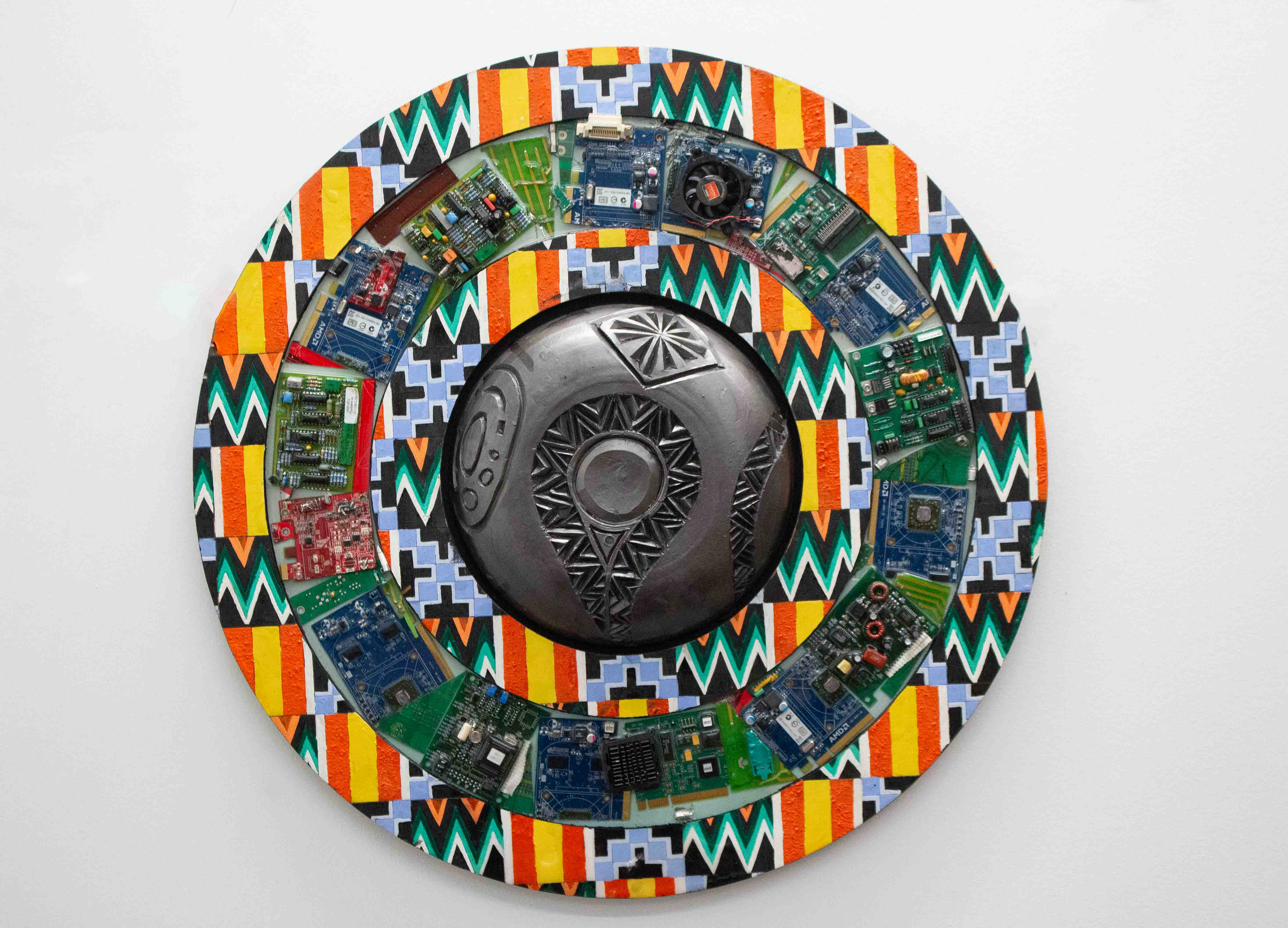 Vincent “Sniper” Frimpong, My Two Eyes I, 2024, stoneware, resin, wood, motherboards, 24”x24”x3”