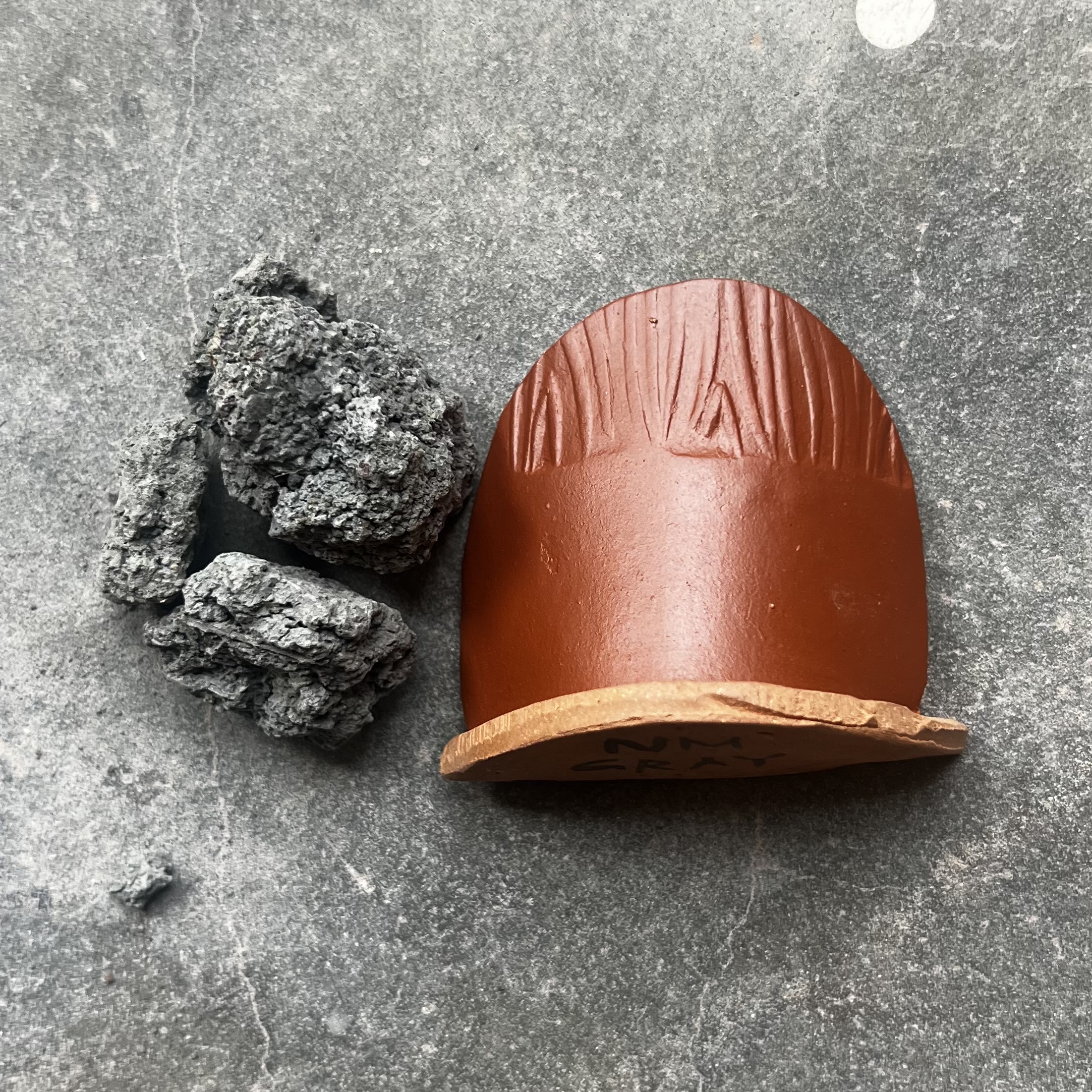New Mexico Gray. A gray clay from the mountains of New Mexico that fires bright red.
