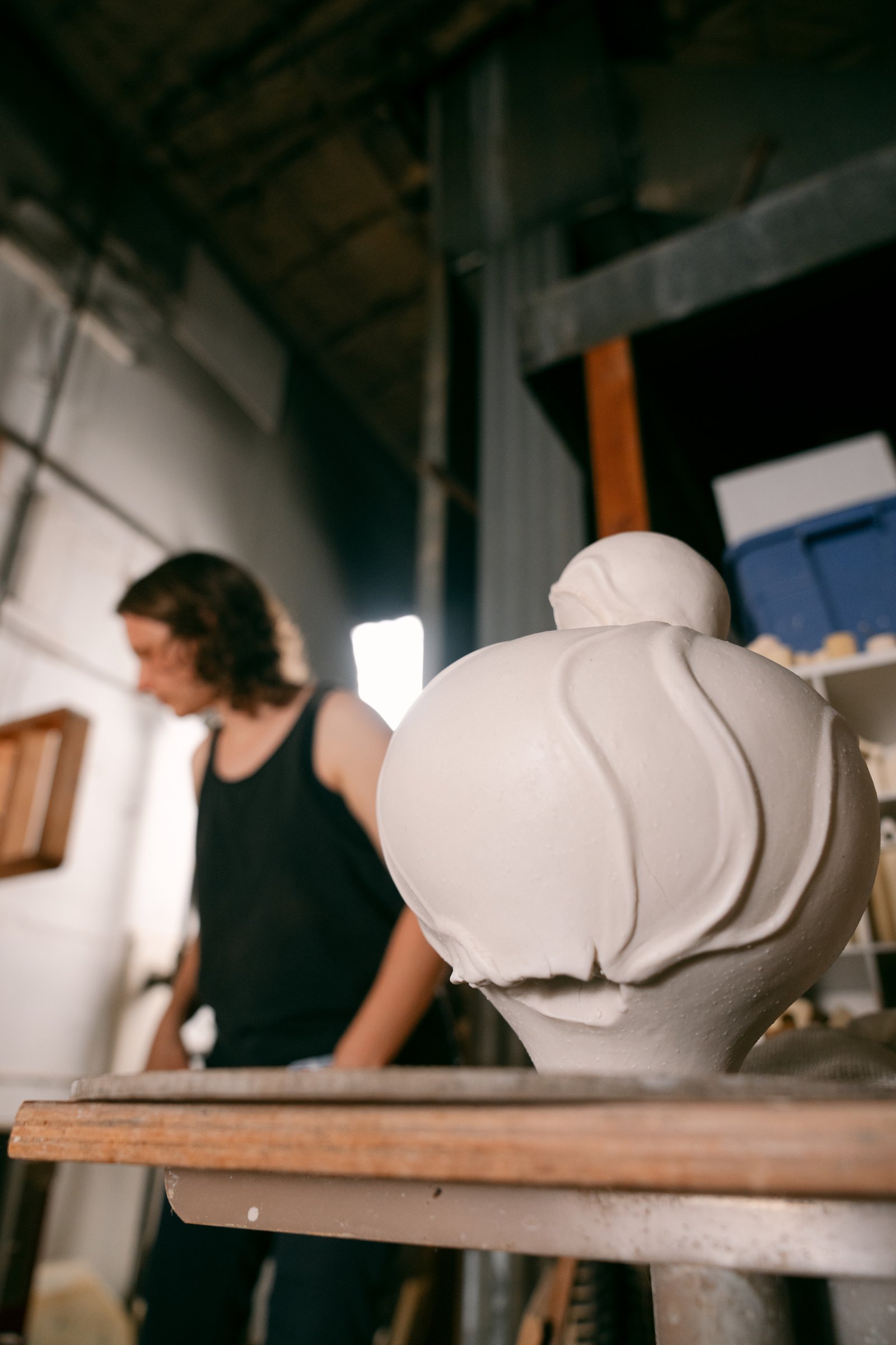 Venus, A Self Portrait” sculpted, cone 6, porcelain vessel with menstrual blood included in a singular vein flowing on the piece, in process coming out of glaze firing. Photo courtesy of Ty and Chey.